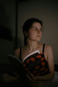 a person reading horror book